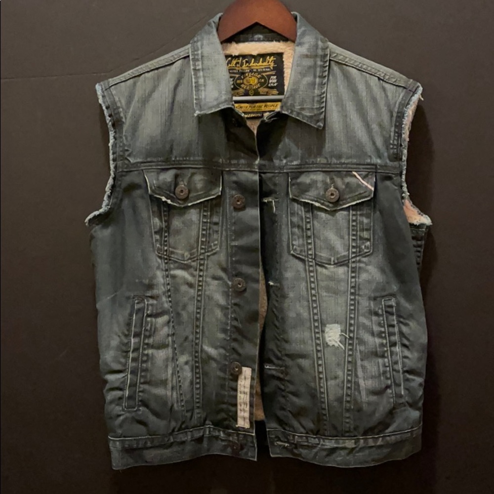 Vintage wash denim vest with plush lining.